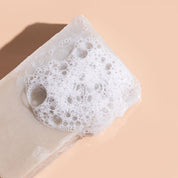 A bit Hippy Cleansing Hemp & Olive Body Bar 115g covered in bubbles, natural Australian-made soap with hemp seed oil and olive clay for hydrating and purifying skin