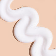 A bit Hippy Conditioner swatch on neutral peach backdrop, natural ingredients including Jojoba, Rapeseed and Vitamin B5 to moisturise, strengthen and tame split ends