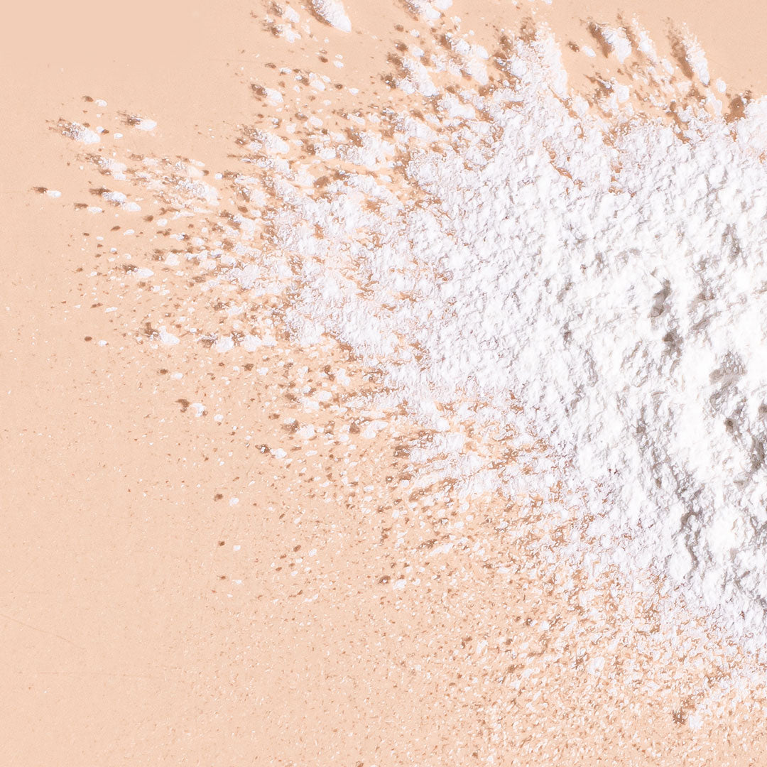  A bit Hippy anti-irritation dry shampoo powder spread across peach background, irritation and alcohol free hair washing alternative. 