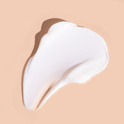 A bit Hippy moisturiser swatch on peach background, non comedogenic moisturiser to hydrate the whole body and soothe sensitive skin.