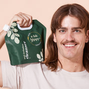 Man holding A bit Hippy cleanser 1L refill pouch, natural sulphate-free wash for sensitive skin