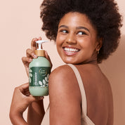 Model showcasing A bit Hippy Cleanser 500ml bottle, gentle aloe infused wash for sensitive skin, natural and irritation free