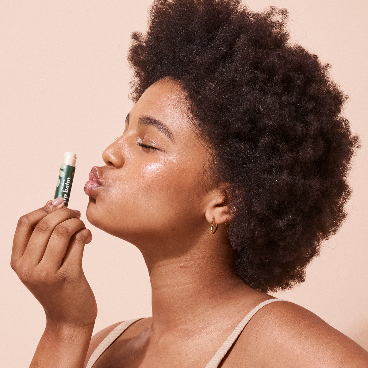woman kissing A bit Hippy Coconut Lime SPF15 Lip Balm, natural lip balm with SPF for hydration and sun protection