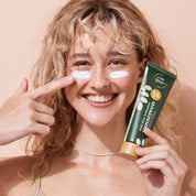 A bit Hippy Sunscreen SPF 40 applied by smiling woman, natural clear zinc cream offering UVA UVB protection, gentle sunscreen for kids and sensitive skin